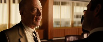 Movie still from “Thank You for Smoking” (2005), directed by Jason Reitman – An older man in a suit and tie in an office setting; Close Up shot, Over the shoulder angle