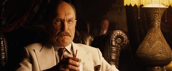 Movie still from “Thank You for Smoking” (2005), directed by Jason Reitman – An older man sitting in a chair holding a drink; Close Up shot, Low angle