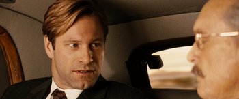 Movie still from “Thank You for Smoking” (2005), directed by Jason Reitman – A person wearing a suit in a car; Close Up shot, Over the shoulder angle