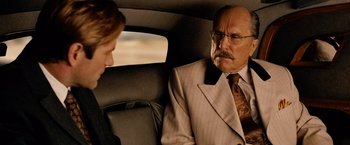 Movie still from “Thank You for Smoking” (2005), directed by Jason Reitman – A man and a woman sitting in the back of a car; Medium shot, Over the shoulder angle