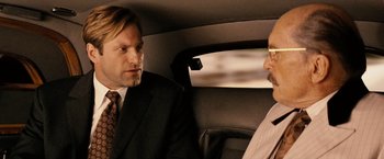 Movie still from “Thank You for Smoking” (2005), directed by Jason Reitman – Two men in suits in the back seat of a car; Close Up shot, Over the shoulder angle