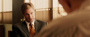 Movie still from “Thank You for Smoking” (2005), directed by Jason Reitman – A person wearing a suit and a tie; Close Up shot, Over the shoulder angle