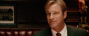 Movie still from “Thank You for Smoking” (2005), directed by Jason Reitman – A person wearing a suit and tie; Close Up shot, Over the shoulder angle