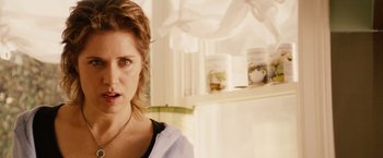 Movie still from “Thank You for Smoking” (2005), directed by Jason Reitman – A person in a kitchen near a refrigerator; Close Up shot, Over the shoulder angle
