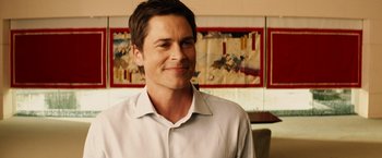 Movie still from “Thank You for Smoking” (2005), directed by Jason Reitman – A person wearing a white shirt; Close Up shot, Over the shoulder angle