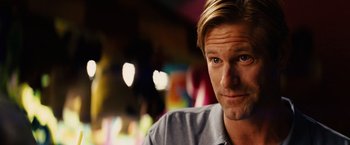 Movie still from “Thank You for Smoking” (2005), directed by Jason Reitman – A person wearing a gray shirt; Close Up shot, Over the shoulder angle