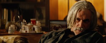 Movie still from “Thank You for Smoking” (2005), directed by Jason Reitman – An older man sitting at a table in front of a television; Close Up shot, Over the shoulder angle