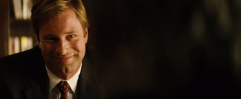 Movie still from “Thank You for Smoking” (2005), directed by Jason Reitman – A person wearing a suit and tie; Close Up shot, Over the shoulder angle