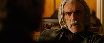 Movie still from “Thank You for Smoking” (2005), directed by Jason Reitman – An older man with long white hair and a beard; Close Up shot, Over the shoulder angle