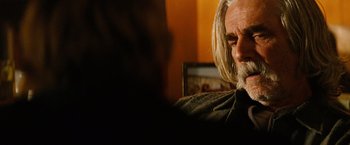 Movie still from “Thank You for Smoking” (2005), directed by Jason Reitman – A person with long white hair; Close Up shot, Over the shoulder angle