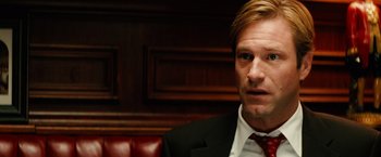 Movie still from “Thank You for Smoking” (2005), directed by Jason Reitman – A person wearing a suit and tie; Close Up shot, Over the shoulder angle