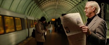 Movie still from “Thank You for Smoking” (2005), directed by Jason Reitman – A person reading a newspaper in a subway station; Extreme Close Up shot, Low angle
