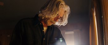 Movie still from “Thank You for Smoking” (2005), directed by Jason Reitman – A man with long white hair wearing glasses and a black shirt; Close Up shot, Low angle
