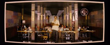 Movie still from “Thank You for Smoking” (2005), directed by Jason Reitman – A man standing in front of a group of people; Wide shot, Low angle