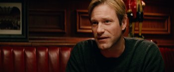 Movie still from “Thank You for Smoking” (2005), directed by Jason Reitman – A person sitting in a booth; Close Up shot, Over the shoulder angle