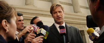 Movie still from “Thank You for Smoking” (2005), directed by Jason Reitman – A man in a business suit is being interviewed by reporters; Close Up shot, Low angle