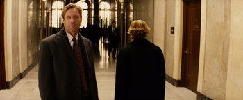 Movie still from “Thank You for Smoking” (2005), directed by Jason Reitman – A man and a woman are walking down a hall way; Medium shot, Over the shoulder angle