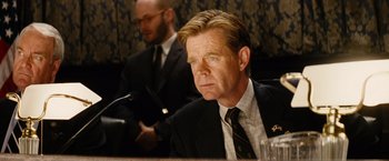 Movie still from “Thank You for Smoking” (2005), directed by Jason Reitman – A man sitting in front of another man in a suit; Close Up shot, Over the shoulder angle