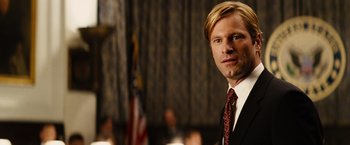 Movie still from “Thank You for Smoking” (2005), directed by Jason Reitman – A person wearing a suit and tie; Close Up shot, Over the shoulder angle