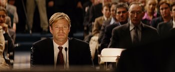 Movie still from “Thank You for Smoking” (2005), directed by Jason Reitman – A man in a suit and tie at a business meeting; Medium shot, Over the shoulder angle