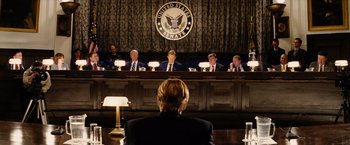 Movie still from “Thank You for Smoking” (2005), directed by Jason Reitman – A woman sitting in front of a group of men; Wide shot, Low angle