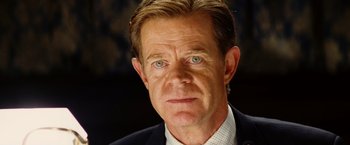 Movie still from “Thank You for Smoking” (2005), directed by Jason Reitman – A person wearing a suit and tie; Close Up shot, High angle