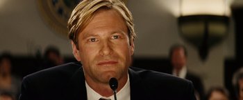 Movie still from “Thank You for Smoking” (2005), directed by Jason Reitman – A person wearing a suit and tie; Close Up shot, Low angle