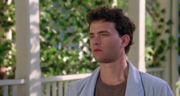 Movie still from “The 'Burbs” (1989), directed by Joe Dante – A man with curly brown hair is looking to his left; Close Up shot, Low angle