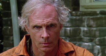 Movie still from “The 'Burbs” (1989), directed by Joe Dante – A person wearing an orange shirt; Close Up shot, Low angle