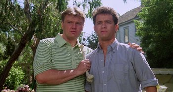 Movie still from “The 'Burbs” (1989), directed by Joe Dante – A couple of men standing next to each other; Close Up shot, Low angle