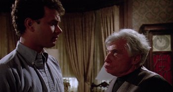 Movie still from “The 'Burbs” (1989), directed by Joe Dante – A man and a woman talking to each other; Close Up shot, Over the shoulder angle