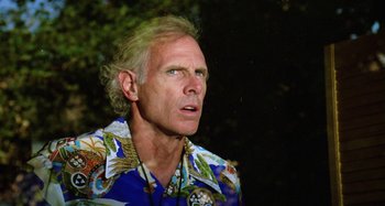 Movie still from “The 'Burbs” (1989), directed by Joe Dante – An older man wearing a hawaiian shirt looking up; Close Up shot, Low angle