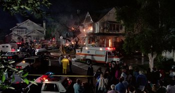 Movie still from “The 'Burbs” (1989), directed by Joe Dante – An ambulance is parked on the side of the street; Extreme Wide shot, High angle