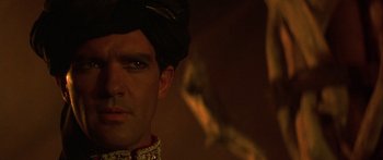 Movie still from “The 13th Warrior” (1999), directed by Michael Crichton – A person wearing a hat; Close Up shot, Over the shoulder angle