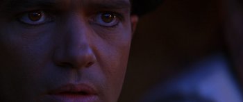 Movie still from “The 13th Warrior” (1999), directed by Michael Crichton – A man's face in the dark; Extreme Close Up shot, Low angle