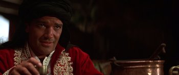 Movie still from “The 13th Warrior” (1999), directed by Michael Crichton – A person wearing a hat; Close Up shot, Over the shoulder angle