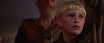 Movie still from “The 13th Warrior” (1999), directed by Michael Crichton – A young boy and an older man are looking into the distance; Close Up shot, Over the shoulder angle