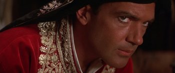 Movie still from “The 13th Warrior” (1999), directed by Michael Crichton – A man wearing a hat; Close Up shot, Low angle