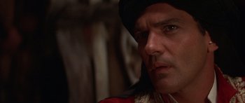 Movie still from “The 13th Warrior” (1999), directed by Michael Crichton – A person wearing a hat; Close Up shot, Over the shoulder angle