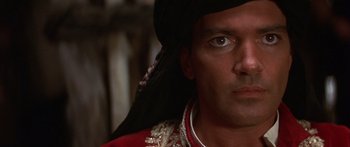 Movie still from “The 13th Warrior” (1999), directed by Michael Crichton – A person wearing a hat; Close Up shot, Low angle