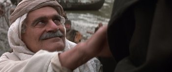 Movie still from “The 13th Warrior” (1999), directed by Michael Crichton – An old man with a mustache and a beard; Close Up shot, Over the shoulder angle