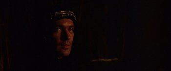 Movie still from “The 13th Warrior” (1999), directed by Michael Crichton – A person wearing a crown; Close Up shot, Over the shoulder angle