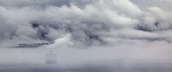 Movie still from “The 13th Warrior” (1999), directed by Michael Crichton – A ship in the middle of the ocean in a cloudy sky; Extreme Wide shot, Low angle