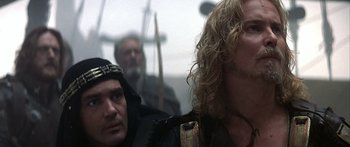 Movie still from “The 13th Warrior” (1999), directed by Michael Crichton – A group of men standing next to each other; Close Up shot, Over the shoulder angle