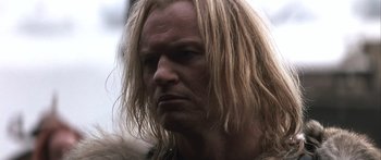 Movie still from “The 13th Warrior” (1999), directed by Michael Crichton – A person with long blonde hair; Close Up shot, Low angle