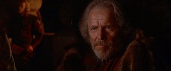Movie still from “The 13th Warrior” (1999), directed by Michael Crichton – An old man with a beard and a mustache; Close Up shot, Low angle