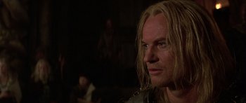 Movie still from “The 13th Warrior” (1999), directed by Michael Crichton – A person with long blonde hair; Close Up shot, Over the shoulder angle