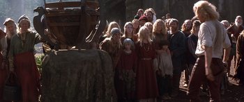 Movie still from “The 13th Warrior” (1999), directed by Michael Crichton – A group of people standing next to each other; Wide shot, High angle