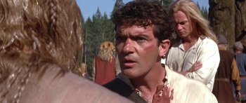 Movie still from “The 13th Warrior” (1999), directed by Michael Crichton – A person with a face tattoo; Close Up shot, Over the shoulder angle