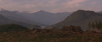 Movie still from “The 13th Warrior” (1999), directed by Michael Crichton – A view of a mountain range with a lot of trees in the background; Extreme Wide shot, Low angle